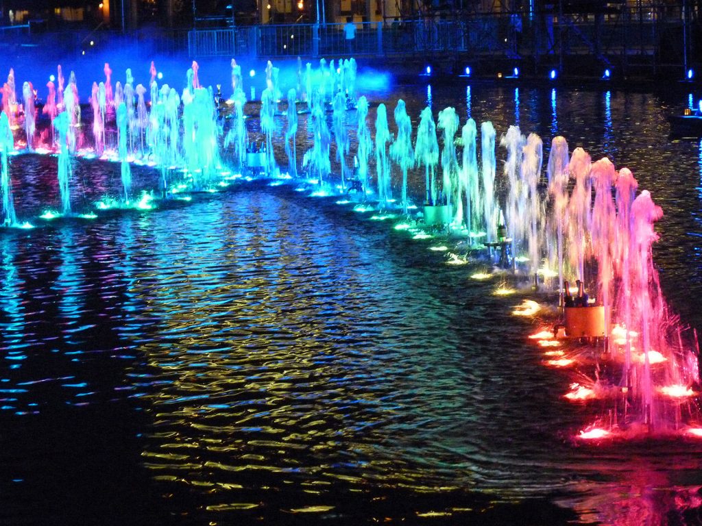 Unique dancing fountain jet water show lit up in bright multi color in Kuala Lumpur