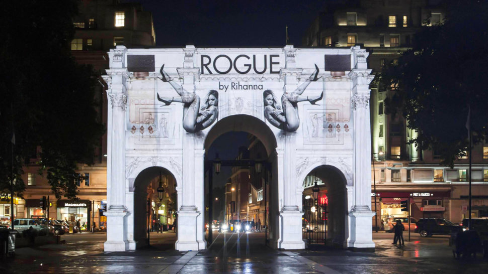 Guerrilla building projection on Marble Arch in London for launch of Rogue by Rihanna
