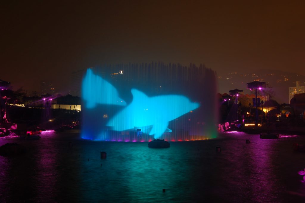 360 jet fountain water screen projection of dolphins by lci for Symbio show at Ocean Park, hong kong