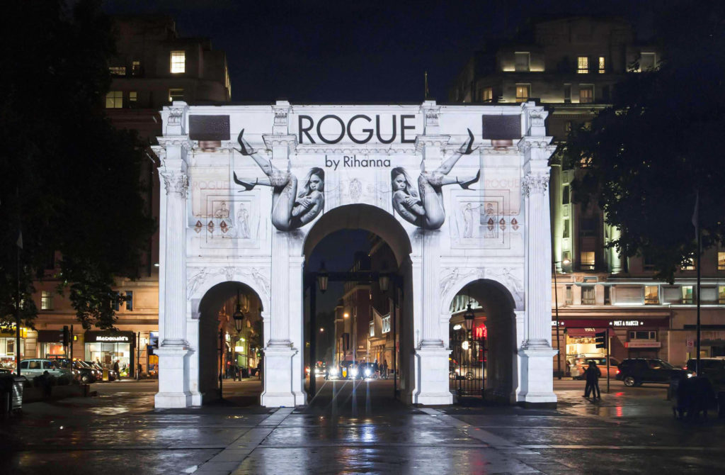 Guerrilla building projection on Marble Arch in London for launch of Rogue by Rihanna